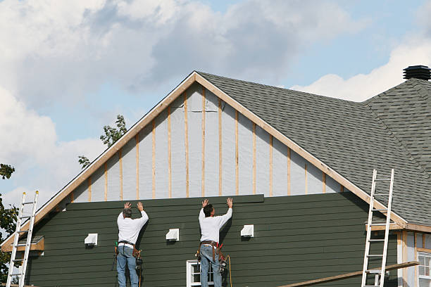 Professional Storm Damage Siding Repair technician working in Harrison, NJ